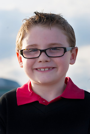 a boy in front of a boat, marina park, lake superior in Thunder Bay